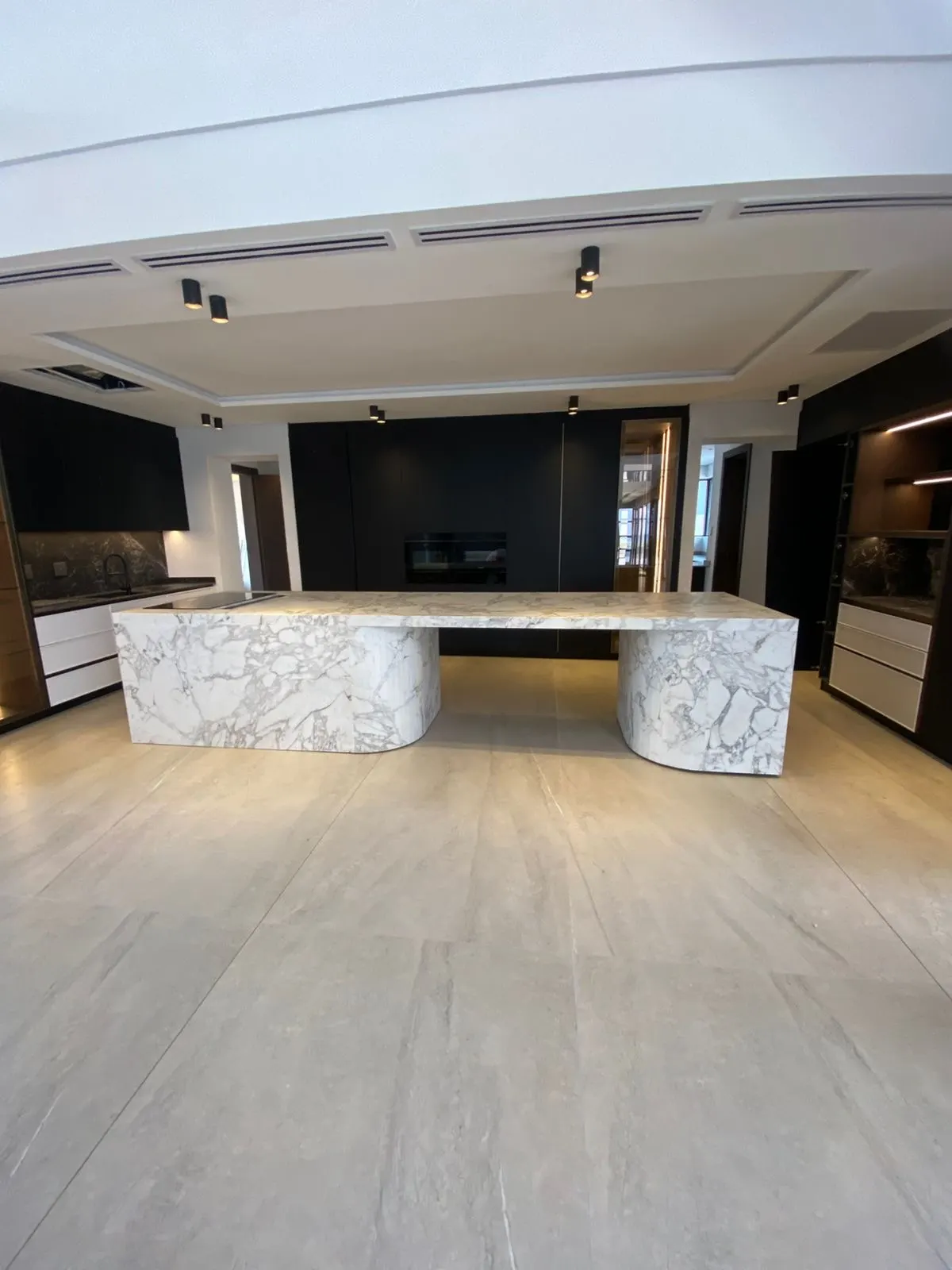 Marble kitchen island in an open-plan space